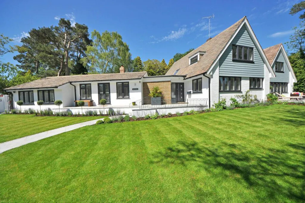Contemporary Redding, CA home exterior with manicured lawn and drought-tolerant garden built by GCR Construction Group